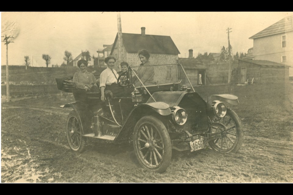 Four people in an automobile ca. 1912.