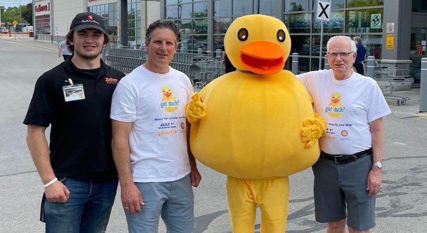 Noah, from left, David and Martin Van Dam – three generations involved in the annual Rotary Club of Guelph-Wellington Duck Race – stand for a photo outside Zehrs during a Duck Days fundraising event. Submitted