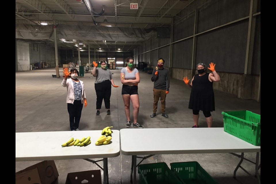 Volunteers Isabella, Meredith, Ayla, Setia and Molly finishing packing produce at The SEED warehouse. 