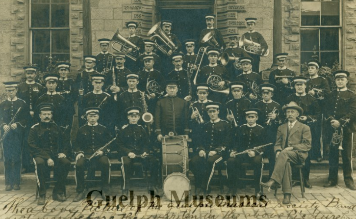 Photo of Guelph Musical Society Band taken in 1912. William Philp is standing behind the bass drum.