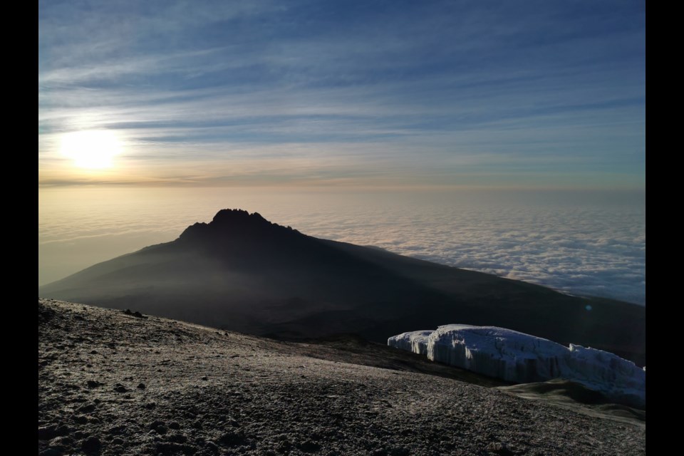 Watching the sunrise at the top of Mt. Kilimanjaro. Submitted photo
