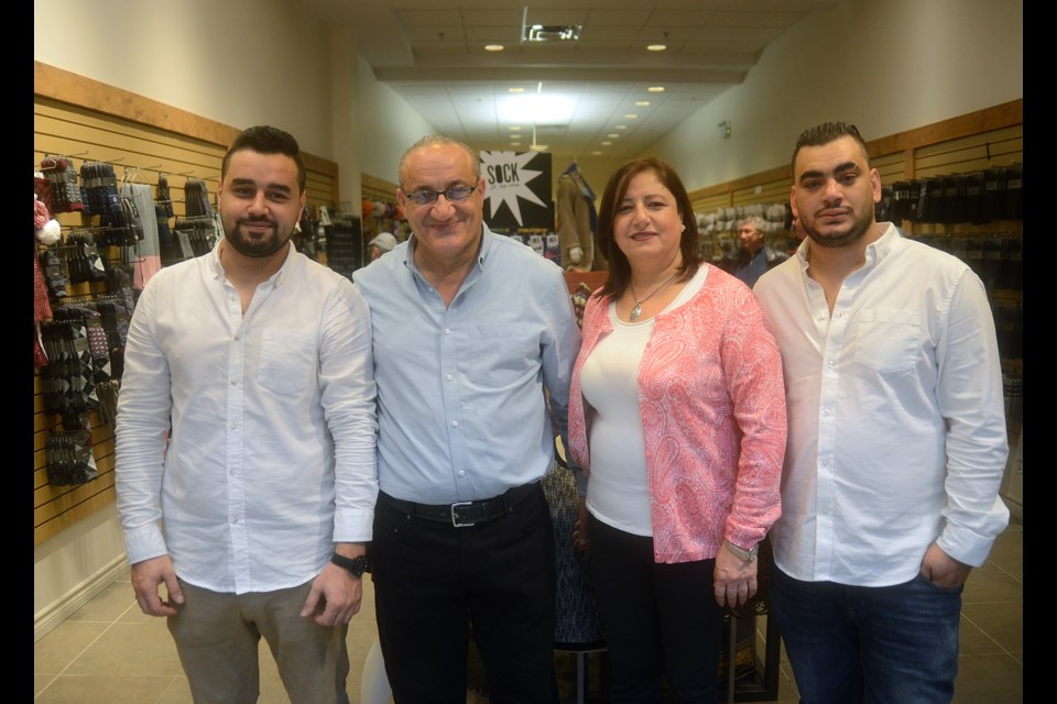 The Abed family: from left, Eyad Abed, Ahmad Abed, Roulah Drak-Alsebai and Tarek Abed, at the official opening of their store in the Old Quebec Street Shoppes Saturday, Oct. 28, 2017. Tony Saxon/GuelphToday.