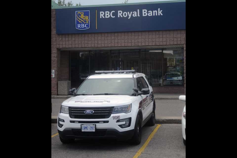 A police cruiser sits outside the Royal Bank in the plaza on the corner of Kortright Road and Gordon Street Thursday, Aug. 3, 2017. Tony Saxon/GuelphToday