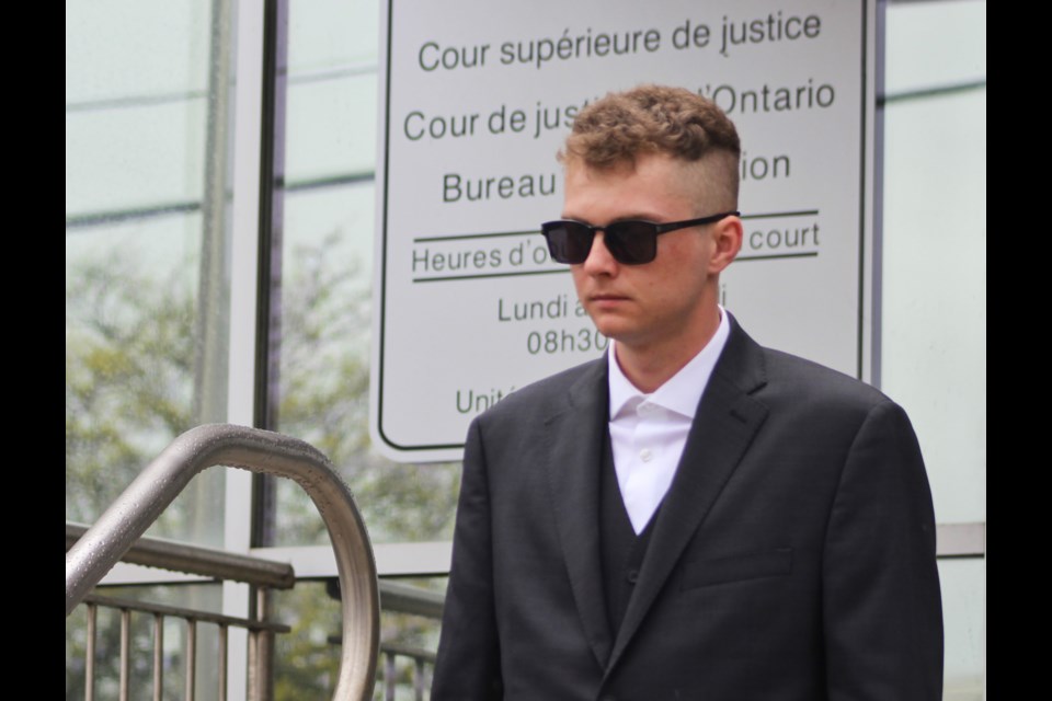 Aidan Kee, charged with second-degree murder in the death of Nick Tanti, exits Superior Court on Woolwich Street 