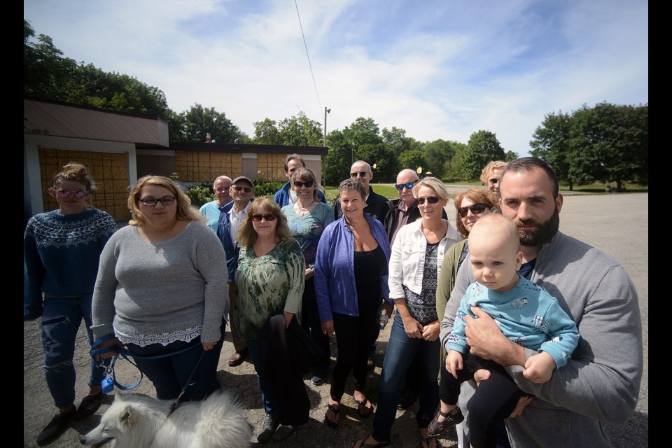 Members of the Beechwood - Chadwick - Hearn Neighbourhood Association gather on the property at 89 Beechwood Ave. west of Downtown Guelph where they are opposing a proposed 34-unit condominium development. Tony Saxon/GuelphToday