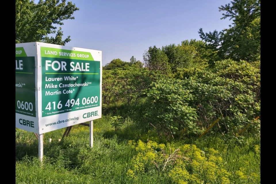 Sale sign on the Guelph Innovation District lands, on the northeast corner of the intersection of Victoria and Stone roads.