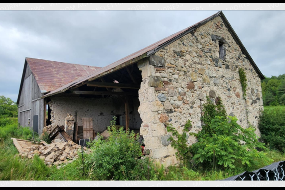A wall collapsed from this circa. 1850 stone barn at 2187 Gordon St.