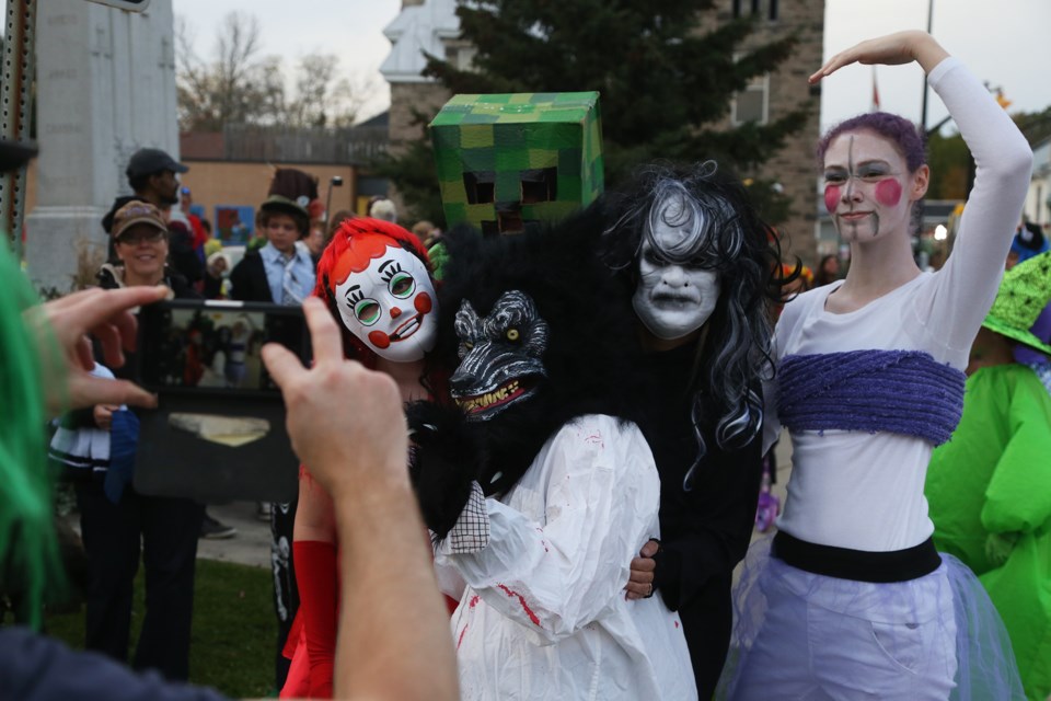 Children of all ages in costume pose for photos immediately prior to the 10th Annual Monster March Parade in Elora on Saturday. Kenneth Armstrong/GuelphToday