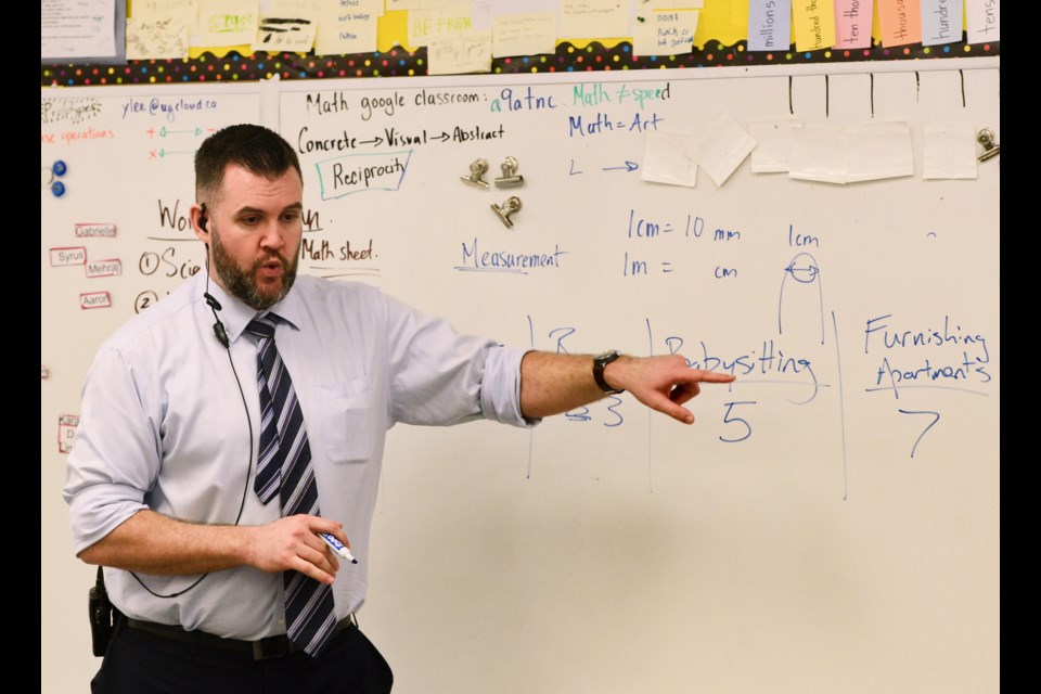 Brant Avenue Public School principal Mike Anderson goes over the various charities available for students to donate too. Tony Saxon/GuelphToday