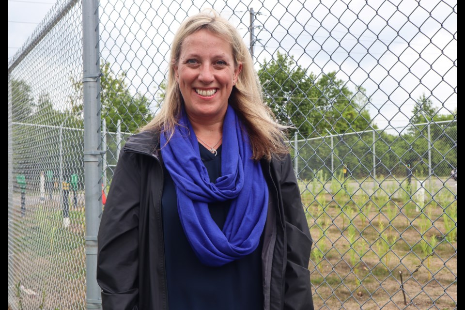 Kari Dunfield standing outside the research site on 201 Alice St. in Guelph.