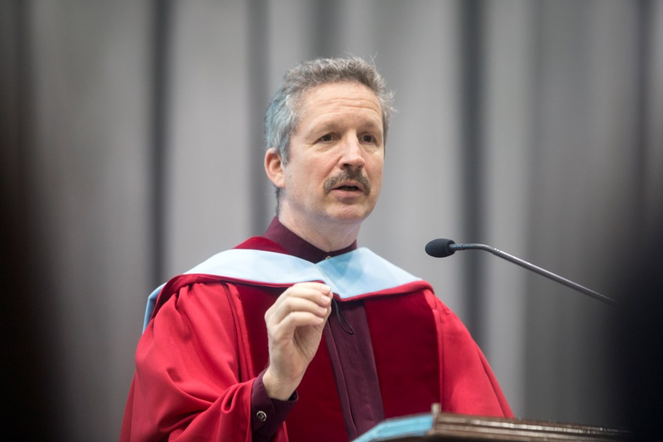 Jim Estill, president and CEO of Danby Products, Ltd., speaks during a U of G convocation ceremony held Tuesday. Estill was presented with an honorary doctorate during the event. Kenneth Armstrong/GuelphToday