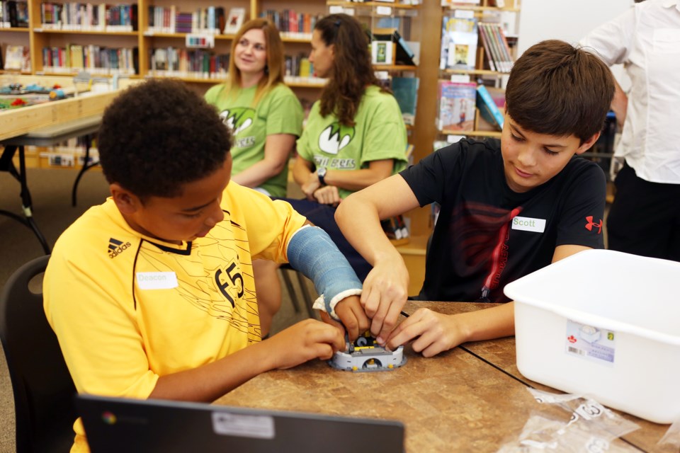 Students from Westminster Woods Public School work together to assemble a model out of Lego for the First Lego League competition. Kenneth Armstrong/GuelphToday
