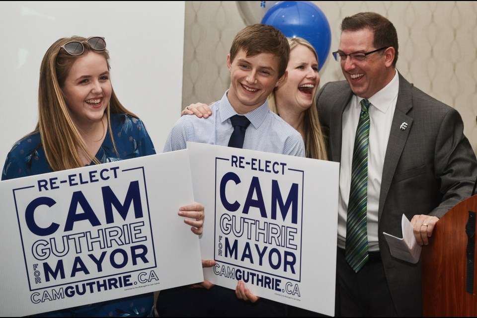 The Guthrie family: Adelaide, from left, Anakin, Rachel and Cam, share a laugh on stage at the Holiday Inn after Cam Guthrie won the mayor's race Monday night. Tony Saxon/GuelphToday