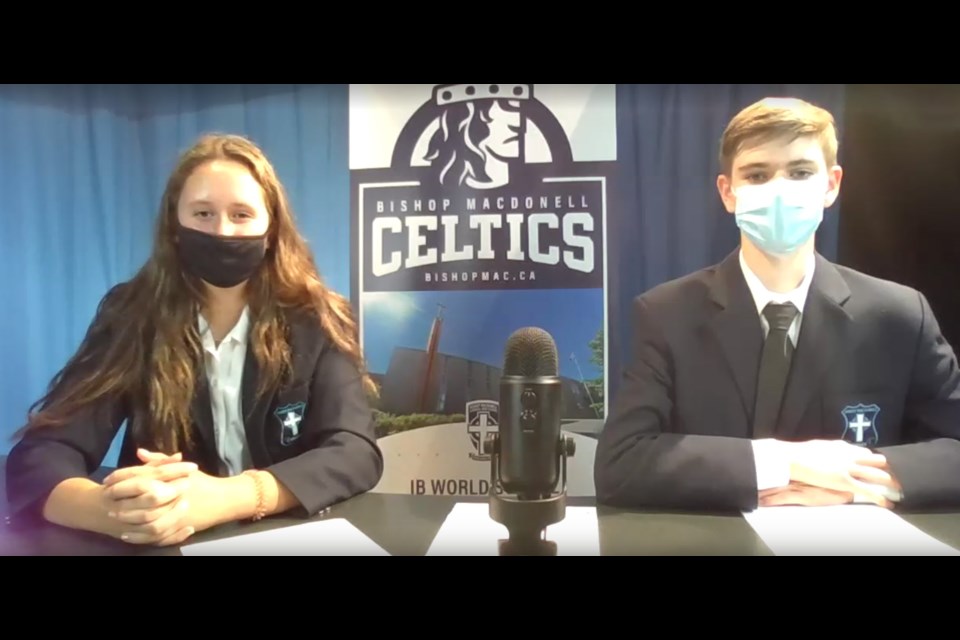 Debate moderators were Martina Gazzola, left, and Owen Marks of Bishop Macdonell Catholic High School.