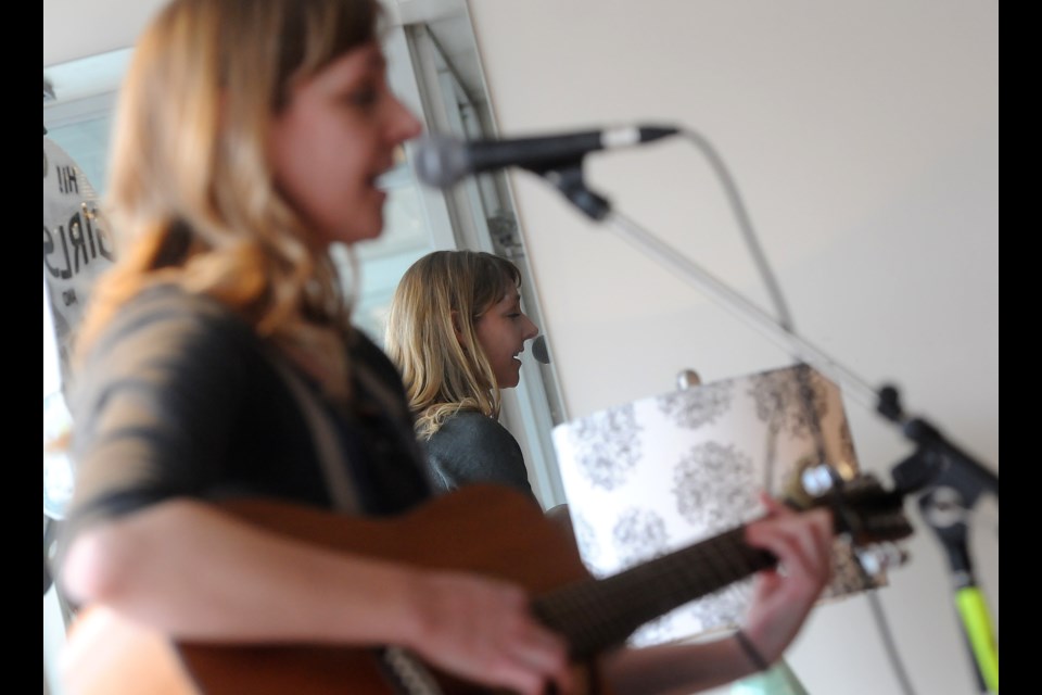 Doris Folkens gets a little reflective while performing at Coriander Saturday, Feb. 11, 2017, as part of the Girls and Guitars event put on by Hillside Inside. Tony Saxon/GuelphToday