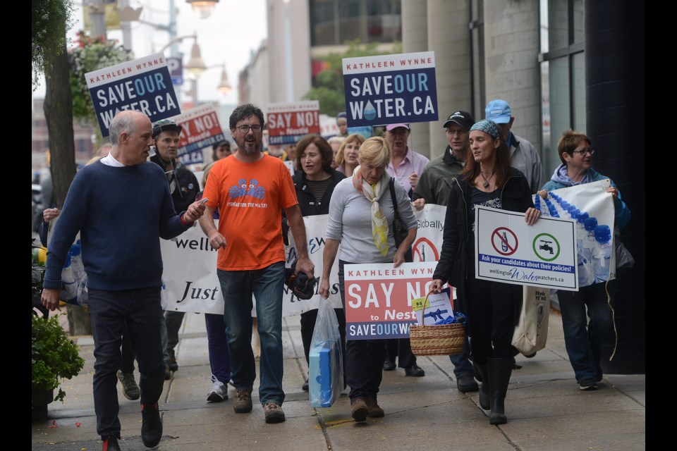 Those attending the Save Our Water rally Friday, Oct. 13, 2017, march up Wyndham Street towards the office of Guelph MPP Liz Sandals. Tony Saxon/GuelphToday