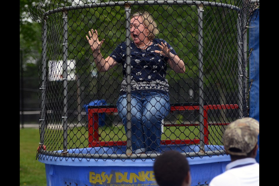 Erin Harvey takes a dunk in the dunking booth at the Shelldale Picnic Friday, July 14, 2017. Tony Saxon/GuelphToday