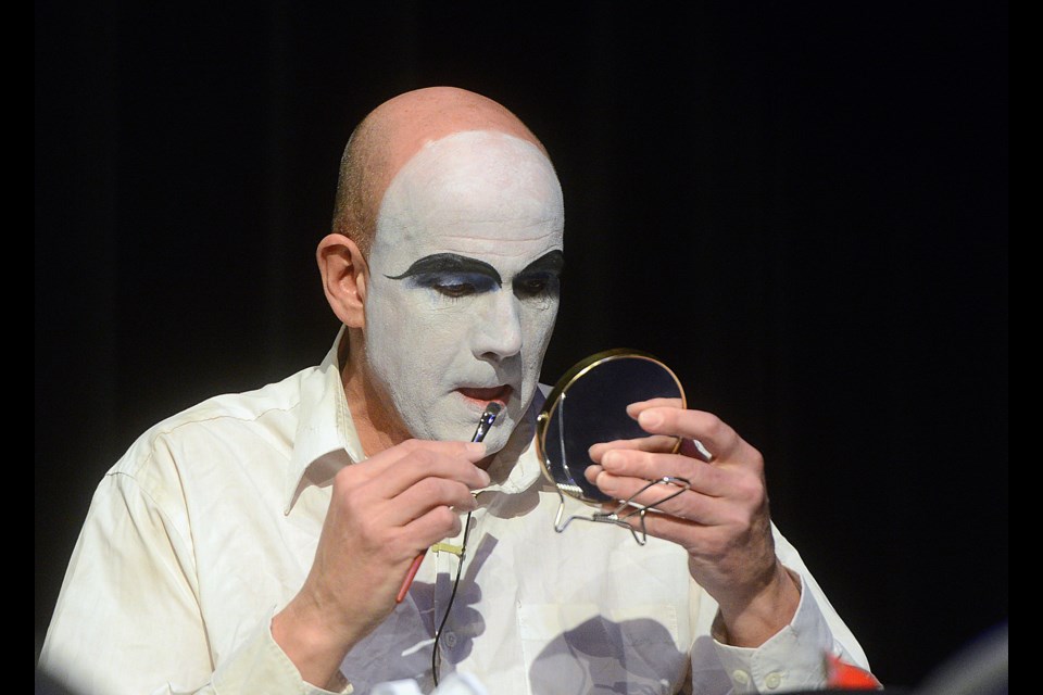 Mike Kennard applies his clown makeup during the panel discussion On Being Clown at the River Run Centre Saturday, Jan. 21, 2017. Tony Saxon/GuelphToday