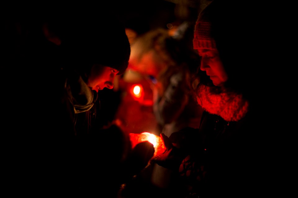 Participants in the Dec. 6th Vigil hold candles in remembrance of the 14 killed  in the 1989 Montreal Massacre and the victims of gender-based violence. Wednesday's event was held at Marianne's Park. Kenneth Armstrong/GuelphToday