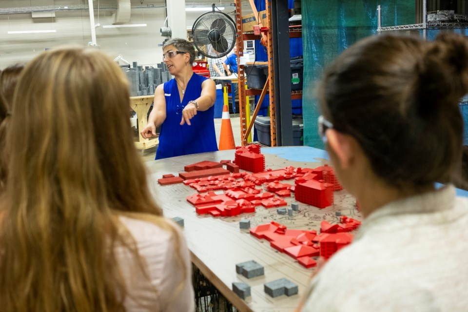 Girls touring engineering firm RWDI are shown some of the work done by women engineers during a tour of the facility for Girls Engineering Day held Wednesday. Kenneth Armstrong/GuelphToday