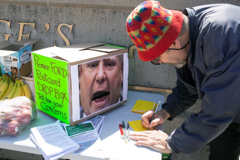 A box decorated with the face of Premier Doug Ford seen during Wednesday's day of action has a slot to accept postcards, which will be delivered to Queen's Park. Kenneth Armstrong/GuelphToday