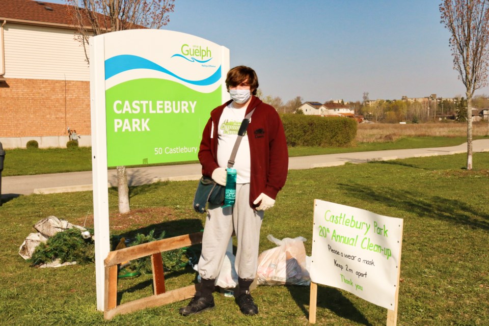 Joshua Cameron standing next to the Castlebury Park sign. Ariel Deutschmann/GuelphToday