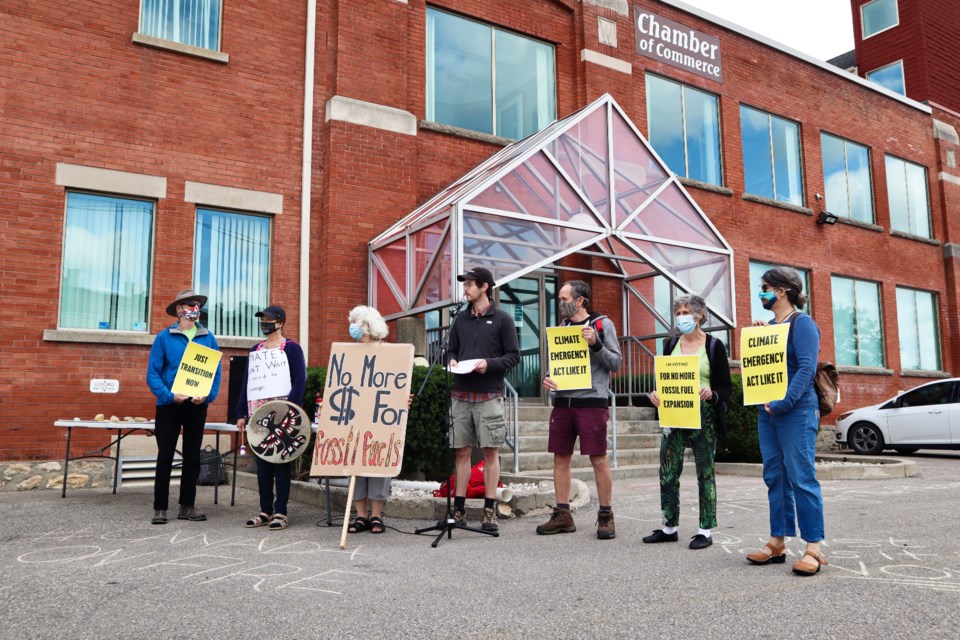 Participants and volunteers of the rally line up outside of MP Lloyd Longfield's office on Friday. Ariel Deutschmann/GuelphToday