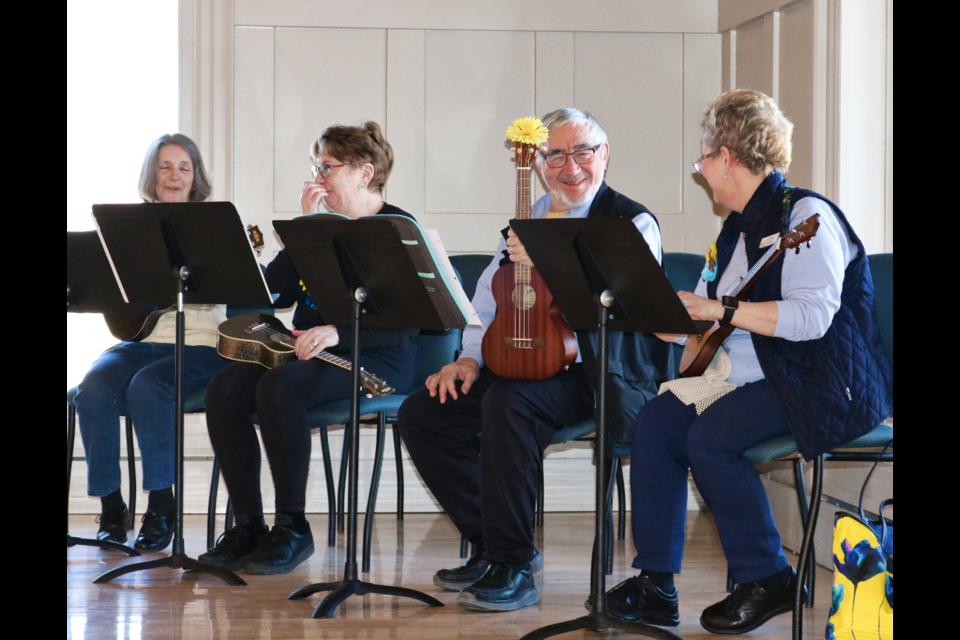 Part of the ensemble for Uke Pals after a performance during the Ukraine Relief Fundraiser at the Village By The Arboretum.  