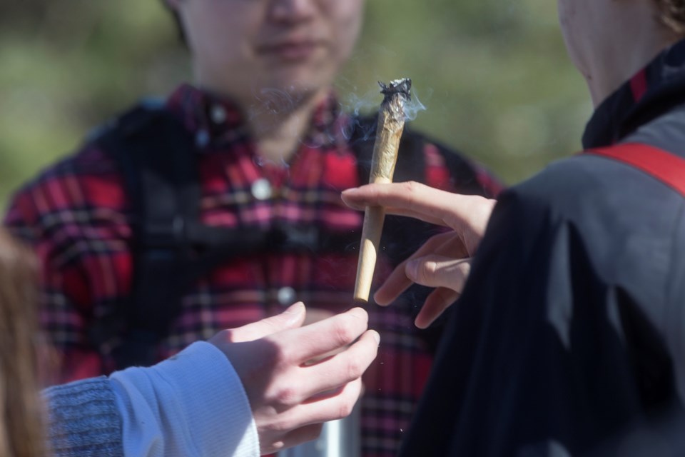 A large joint is passed during a 420 event held Friday at Johnston Green. Kenneth Armstrong/GuelphToday