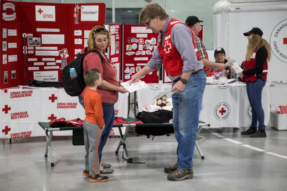 Red Cross volunteers speak to people at an Emergency Preparedness Day display held Wednesday at the West End Community Centre. National Emergency Preparedness Week is May 6 to 12. Kenneth Armstrong
