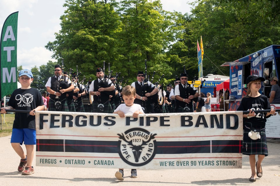 The Fergus Pipe Band parades through the Fergus Scottish Festival grounds on Sunday. Kenneth Armstrong/GuelphToday