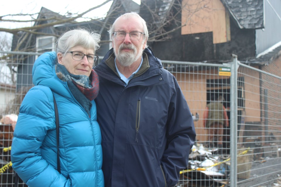 Debbie Sippel Eitzen and her husband Werner Eitzen stand outside their West Acres Drive home in Guelph, just over a week after a garage fire displaced the couple.