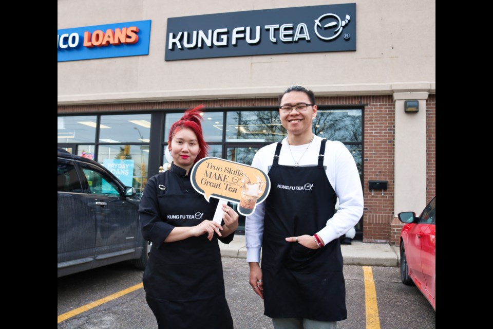 Mango Le, left, and Tai Huynh stand outside Kung Fu Tea on Silvercreek Parkway North.