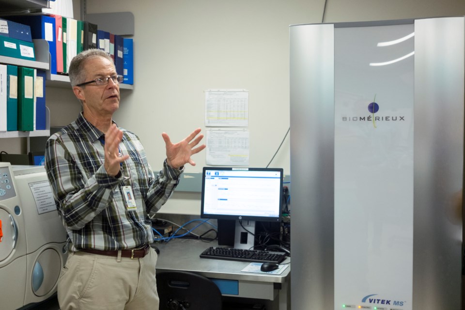 John Tarbush, laboratory supervisor at Guelph General Hospital, stands next to the Microbiology Lab's newest piece of equipment, the $250,000 MALDI-TOF. Kenneth Armstrong/GuelphToday