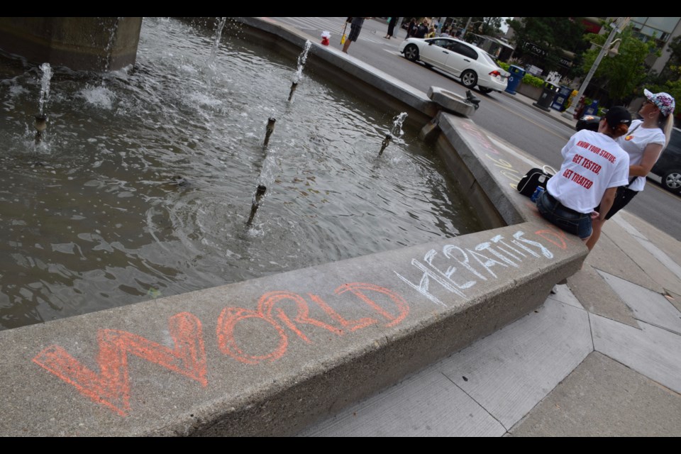 Writing on the fountain wall. (Rob O'Flanagan/GuelphToday)