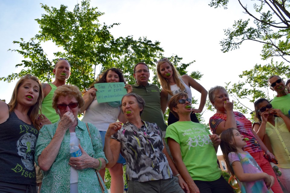 About a dozen people took part in the "Lyme Sucks" event in Market Square Wednesday. (Rob O'Flanagan/GuelphToday)