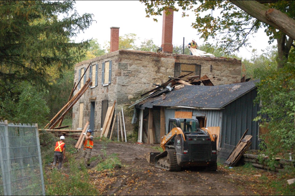 A crew was actively dismantling the historic farmhouse at 979 Victoria Rd. on Wednesday morning.