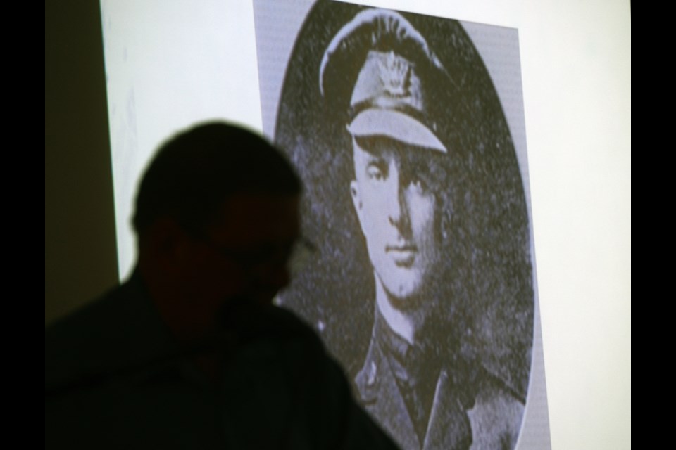 Ed Butts is silhouetted against an image of Rev. William Hindson, one of Guelph's WW1 veterans, at a Vimy Ridge event at Guelph Civic Museum Saturday, April 8, 2017. Tony Saxon/GuelpHToday