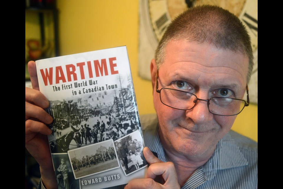 Guelph author Ed Butts holds his latest work, which looks at what life was like in Guelph during World War I. Tony Saxon/GuelphToday