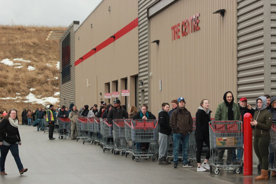 Customers line up outside the Guelph Costco before doors open at 9:30 a.m. Friday. Anam Khan/GuelphToday