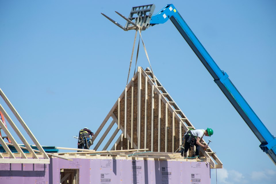 Workers practice physical distancing while building a home at  a Fusion Homes job site. The company has put in place additional health and safety regulations in the face of COVID-19. Kenneth Armstrong/GuelphToday
