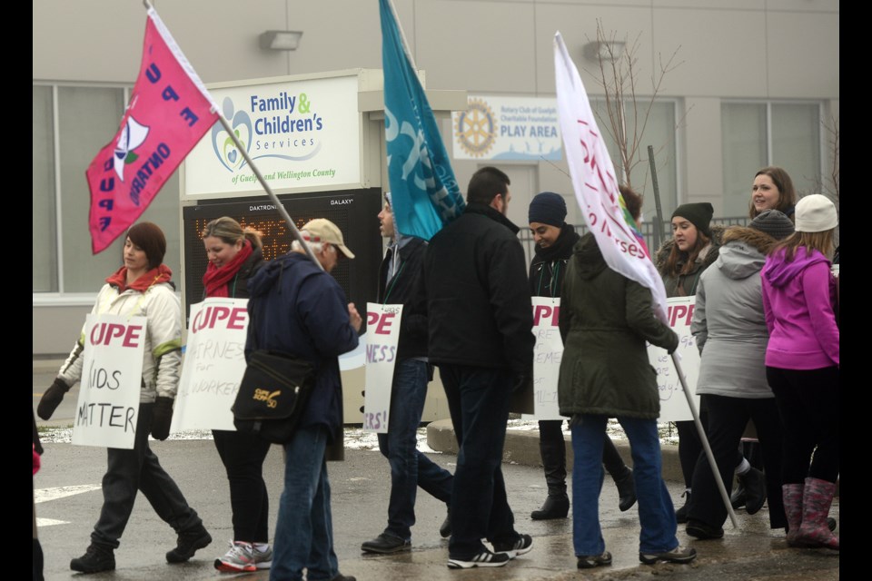 Striking CUPE workers picket in front of the Family and Children's Services of Guelph and Wellington County Monday, April 11, 2016, on Eramosa Road. Tony Saxon/GuelphToday