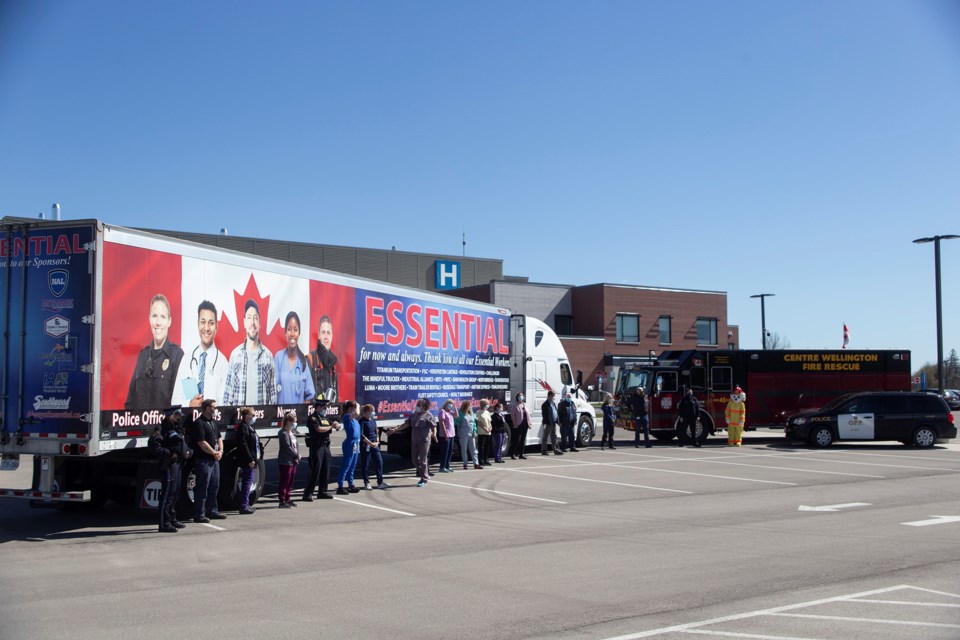 Groves Memorial Hospital staff and first responders take time to pose for photos during the 'Essential Workers Thank You Tour.' A trailer being hauled locally by Ivan Armstrong Trucking will travel to Palmerston on Thursday and to Mount Forest on Friday. Kenneth Armstrong/GuelphToday