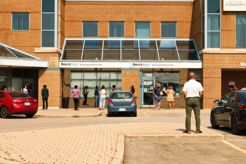 A line of people forms outside the DriveTest Centre on Woodlawn Road W. Ariel Deutschmann/GuelphToday