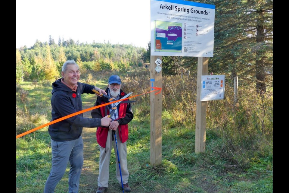 Dave Hull, right, attends a ribbon-cutting ceremony for the Dave Hull Side Trail with the Guelph Hiking Trails Club president John Fisher.