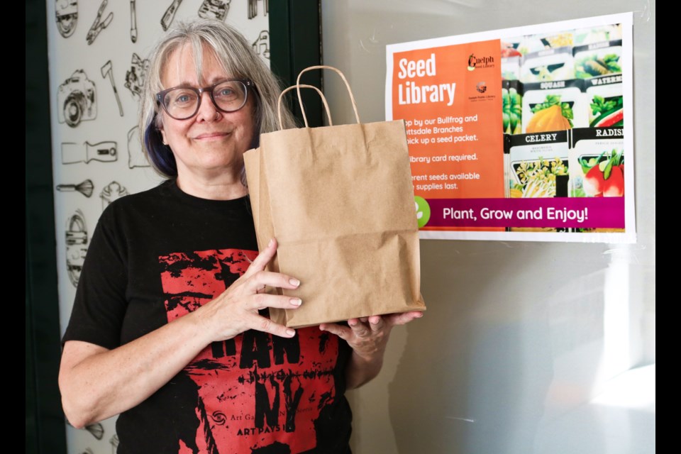 Susan Carey holds up a seed kit she hopes will be available at the Scottsdale and Bull Frog branches of the Guelph Public Library in the future.