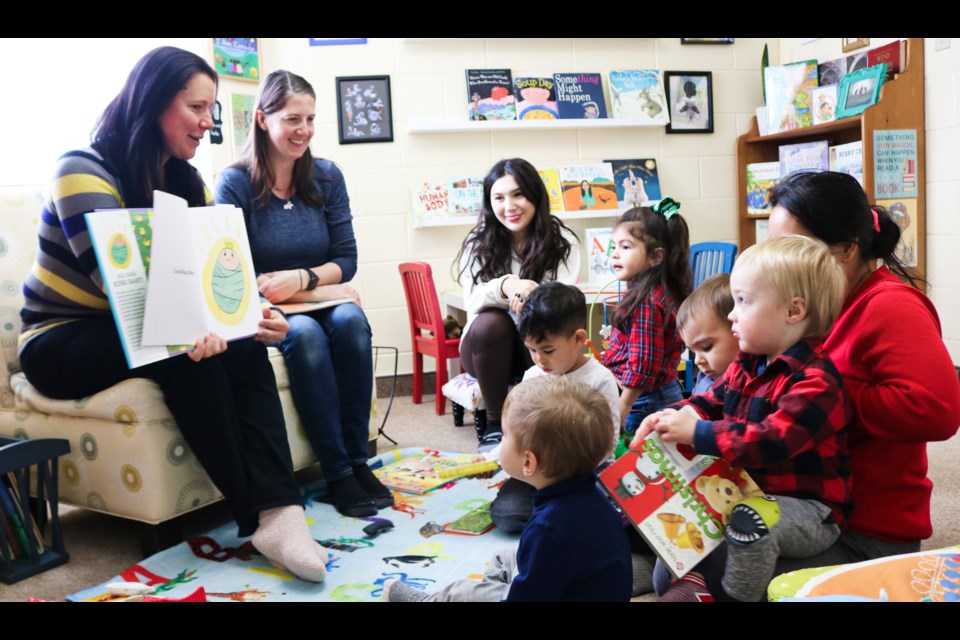 Young children gather for story time in the Children's Reading Room, located at 210 Silvercreek Pkwy.