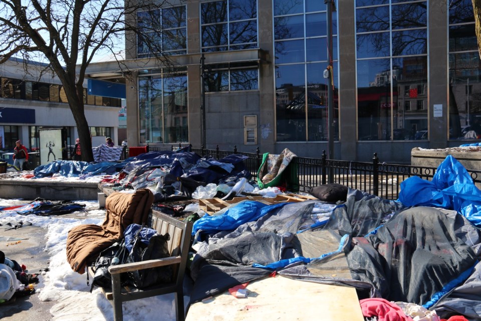 Friends and residents of the St. George's Square encampment were seen taking down their tents and packing up belongings as many of them temporarily move into hotels. 