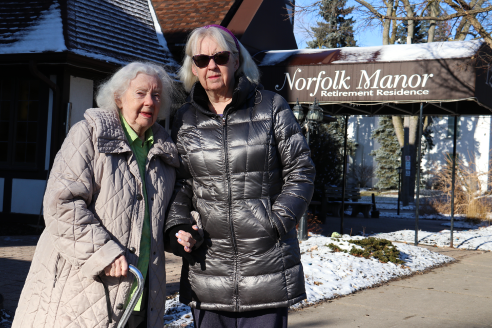 Dawn Fairbanks stands with her 92-year-old mother, Barbara Fairbanks, outside of Norfolk Manor. 