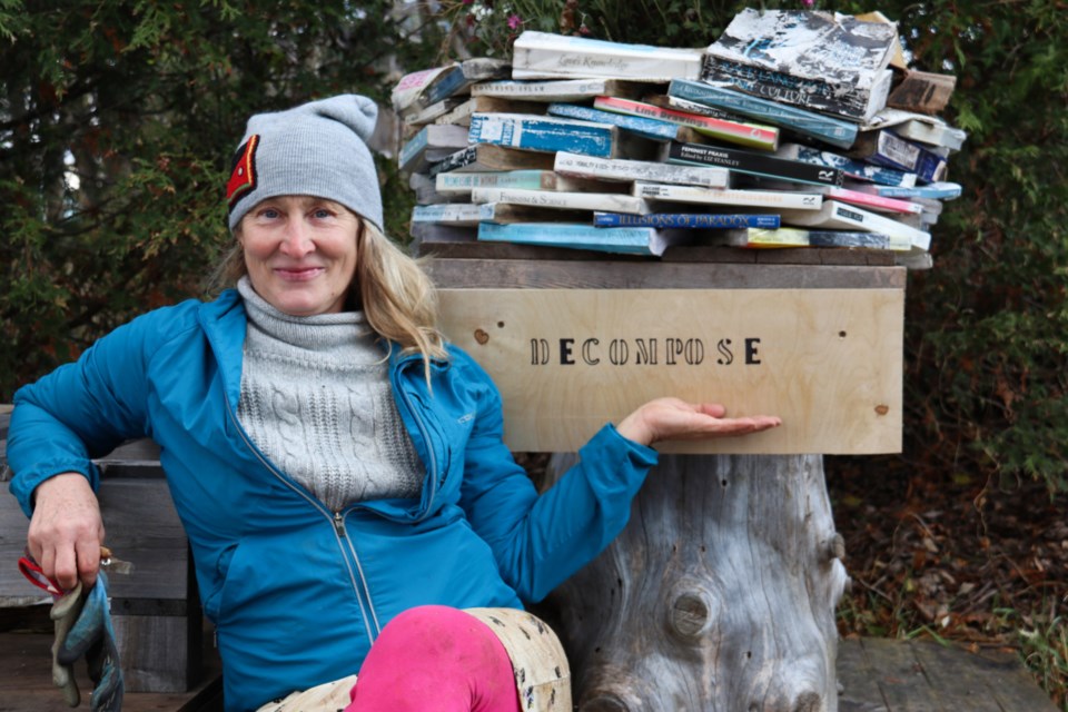 Karen Houle in front of an installation she created with decomposing books. 
